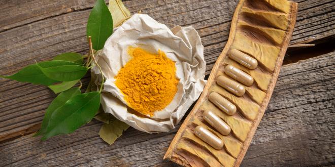 Powdered Curcumin and filled capsules.