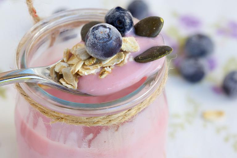 probiotic yogurt in a jar with antioxidant blueberries